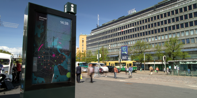 A situated urban display on a Helsinki street, with a map of the area